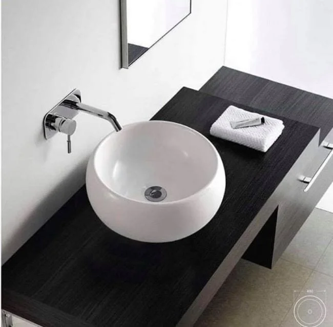 lavamanos redondos en la remodelación de baños